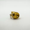 Vintage 9ct gold sea shell charm shown from the front with loop visible