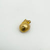 Top view of vintage 9ct gold sea shell charm with bail visible