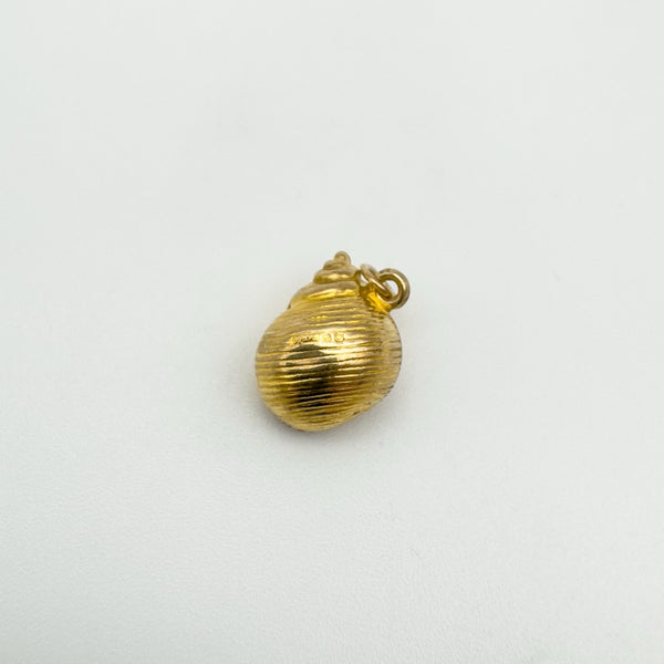 Top view of vintage 9ct gold sea shell charm with bail visible