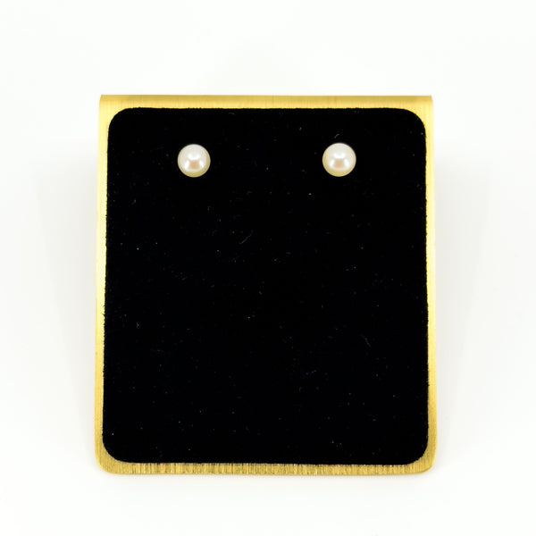 Pair of vintage 9ct gold stud earrings set with round white cultured pearls, displayed on a black jewellery pad.
