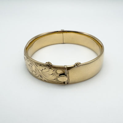Vintage 9ct rolled gold bangle with foliate engraving and clasp.