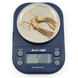 Pair of vintage 9ct rose gold Albertina tassel earrings shown on digital scales weighing approximately 5.88g.