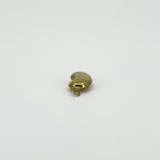 Angled view of vintage 9ct gold lucky bean charm pendant showing its curved hollow form and gold hoop.