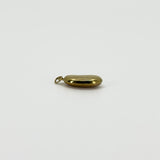 Edge view of vintage 9ct gold lucky bean charm pendant showing the rounded hollow construction and hoop fitting.