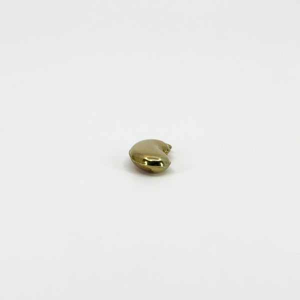End view of vintage 9ct gold lucky bean charm pendant showing its rounded three-dimensional kidney bean form.