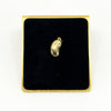 Vintage 9ct gold lucky bean charm pendant displayed on black velvet with polished kidney bean form.