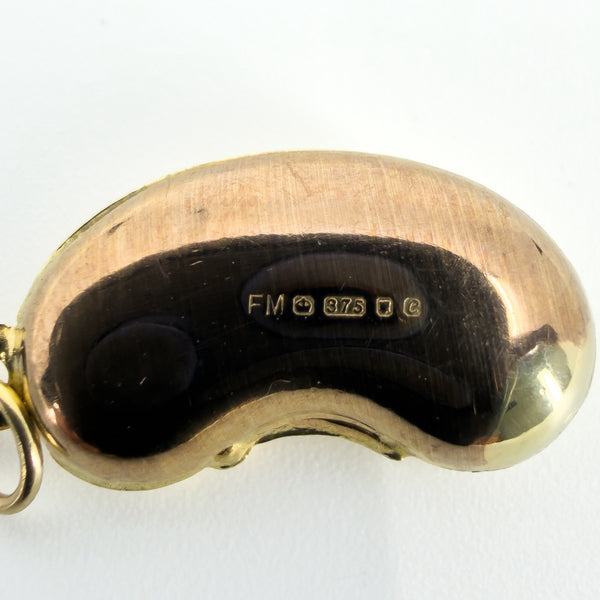 Close-up of vintage 9ct gold lucky bean charm showing FM, crown, 375, London leopard’s head and 1977 date letter.