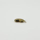 Side view of vintage 9ct gold lucky bean charm pendant showing its hollow three-dimensional form and hoop.