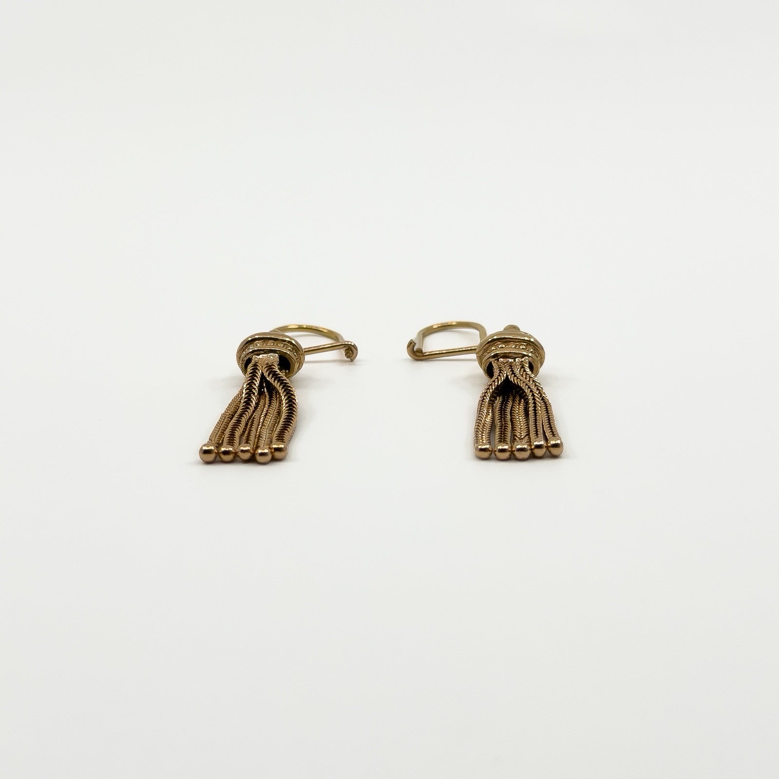 Low front view of the 9ct rose gold Albertina earrings showing the flexible tassel chains and rounded ends.