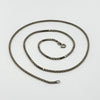 Vintage sterling silver box chain necklace laid flat, showing the square links and spring clasp.