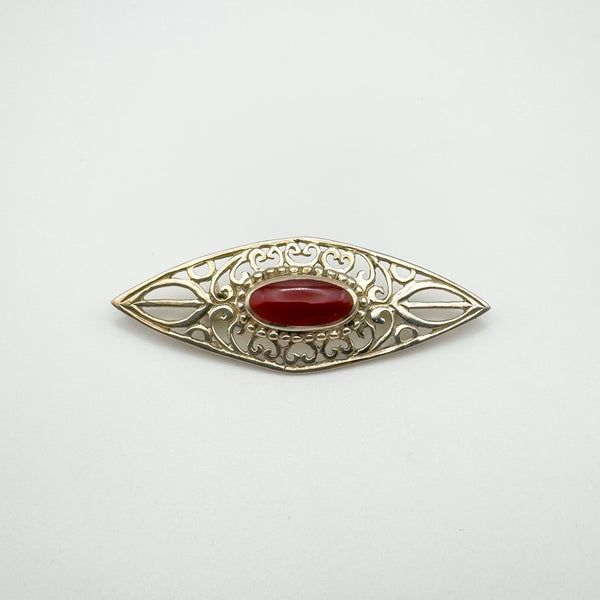 Vintage sterling silver brooch with oval carnelian and Celtic-style openwork