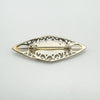 Back of vintage silver brooch with rolling C-clasp and openwork Celtic design