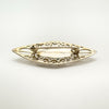Reverse of Celtic-inspired vintage silver brooch with pin fastening