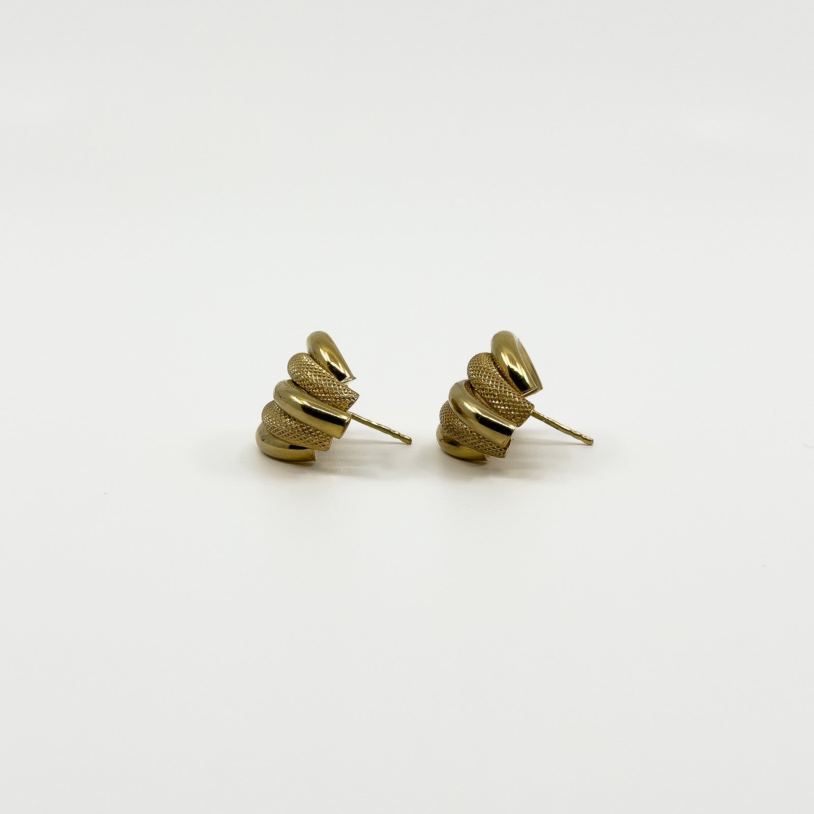 Angled view of vintage 9ct gold half hoop earrings showing the chunky curved mesh and polished strands.