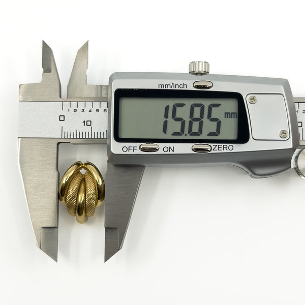 Digital caliper showing a vintage 9ct gold chunky half hoop earring measuring approximately 15.85mm wide.