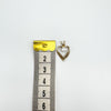 Vintage 9ct gold heart pendant with CZ shown against ruler for size reference.