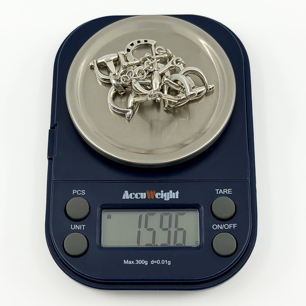 Vintage sterling silver horsebit snaffle bracelet shown on scales weighing approximately 15.96g.