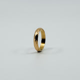 Upright angled view of vintage 18ct rose gold faceted band ring showing the slim full band shape.