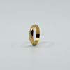 Upright angled view of vintage 18ct rose gold faceted band ring showing the slim full band shape.