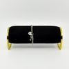Vintage sterling silver curb bracelet shown on black display stand with heart padlock and key charm.