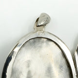 Close up of the 925 stamp inside the sterling silver oval photo locket