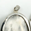 Close up of the 925 stamp inside the sterling silver oval photo locket