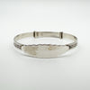 Vintage sterling silver baby bangle with engraved foliate pattern