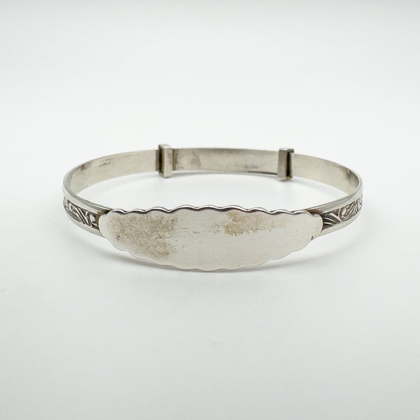 Vintage sterling silver baby bangle with engraved foliate pattern