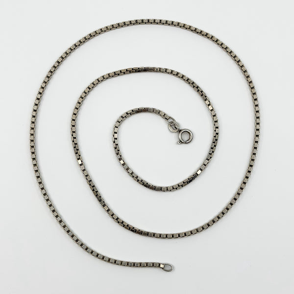 Vintage sterling silver box chain necklace laid flat, showing the 22 inch length and spring clasp.