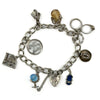 Vintage sterling silver charm bracelet with heart lock, safety chain and assorted charms on oval links.