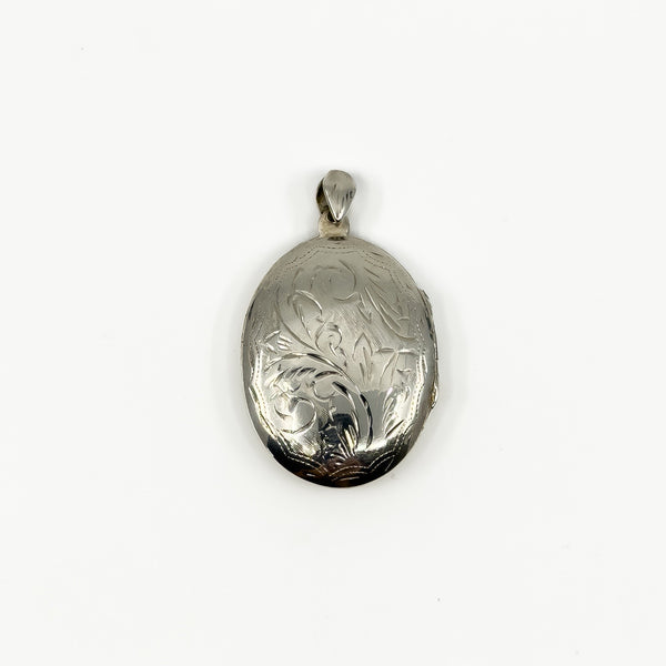 Vintage sterling silver oval engraved photo locket with polished bail and foliate detail