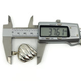 Vintage sterling silver puffy heart locket measured with digital calipers at approximately 37.6mm.