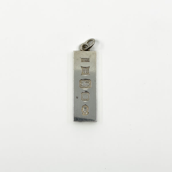 Hallmark close up on vintage sterling silver ingot pendant with Birmingham 1977 marks