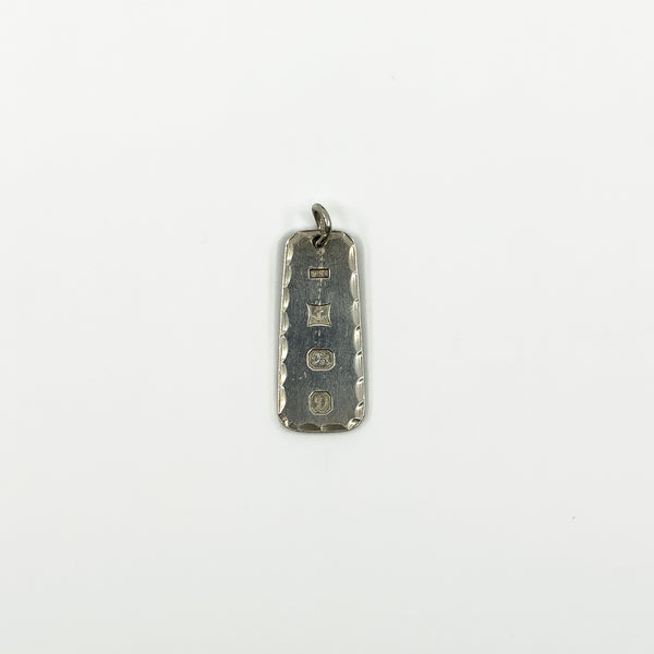 Vintage sterling silver ingot pendant showing Birmingham 1978 hallmarks on the reverse.