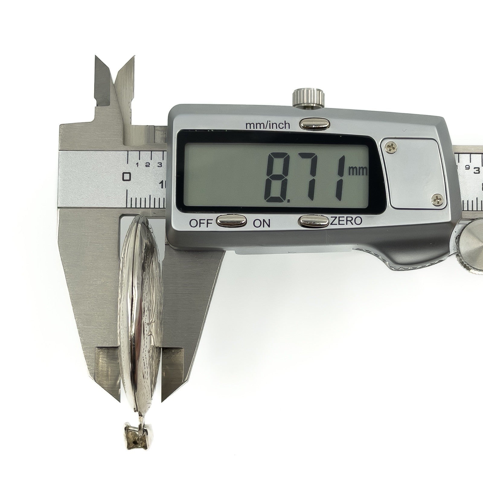 Side measurement of a vintage sterling silver oval locket showing 8.71mm depth