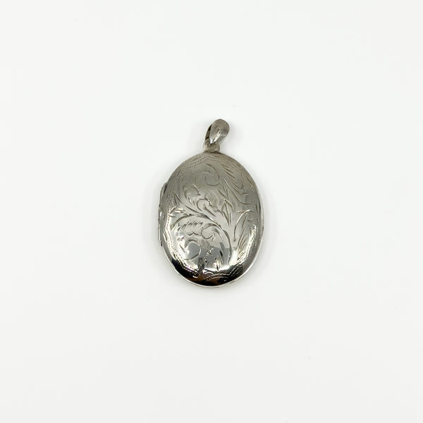 Vintage sterling silver oval photo locket with foliate engraving and polished bail