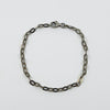 Vintage sterling silver oval link charm bracelet with lobster clasp, shown flat in full view