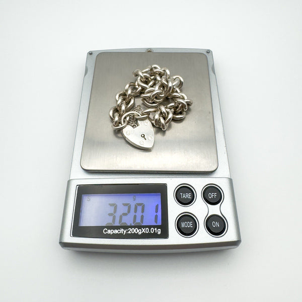 Vintage sterling silver bracelet weighing 32.01 grams on digital scale