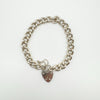 Vintage sterling silver curb bracelet with heart padlock clasp and safety chain