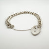 Side view of vintage silver bracelet with functional heart padlock