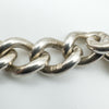 Close-up of hallmark stamps on the sterling silver bracelet links