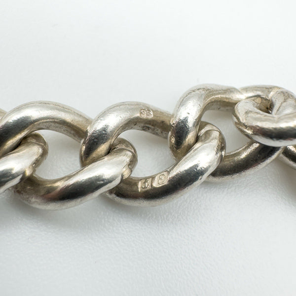 Close-up of hallmark stamps on the sterling silver bracelet links