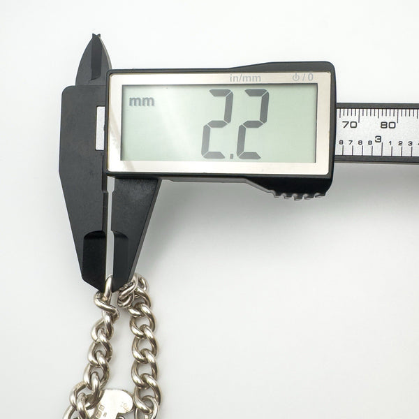 Measuring silver curb link thickness with digital calipers