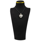 Vintage sterling silver puffy heart photo locket pendant shown on a black display cord.