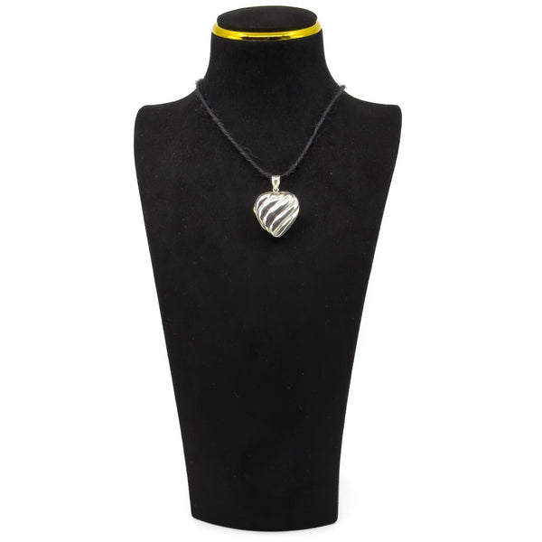 Vintage sterling silver puffy heart photo locket pendant shown on a black display cord.