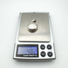 Locket on scales weighing 4.82 grams