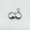 Open vintage silver locket showing matching etched sides