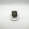 Underside of silver ring showing gemstone settings