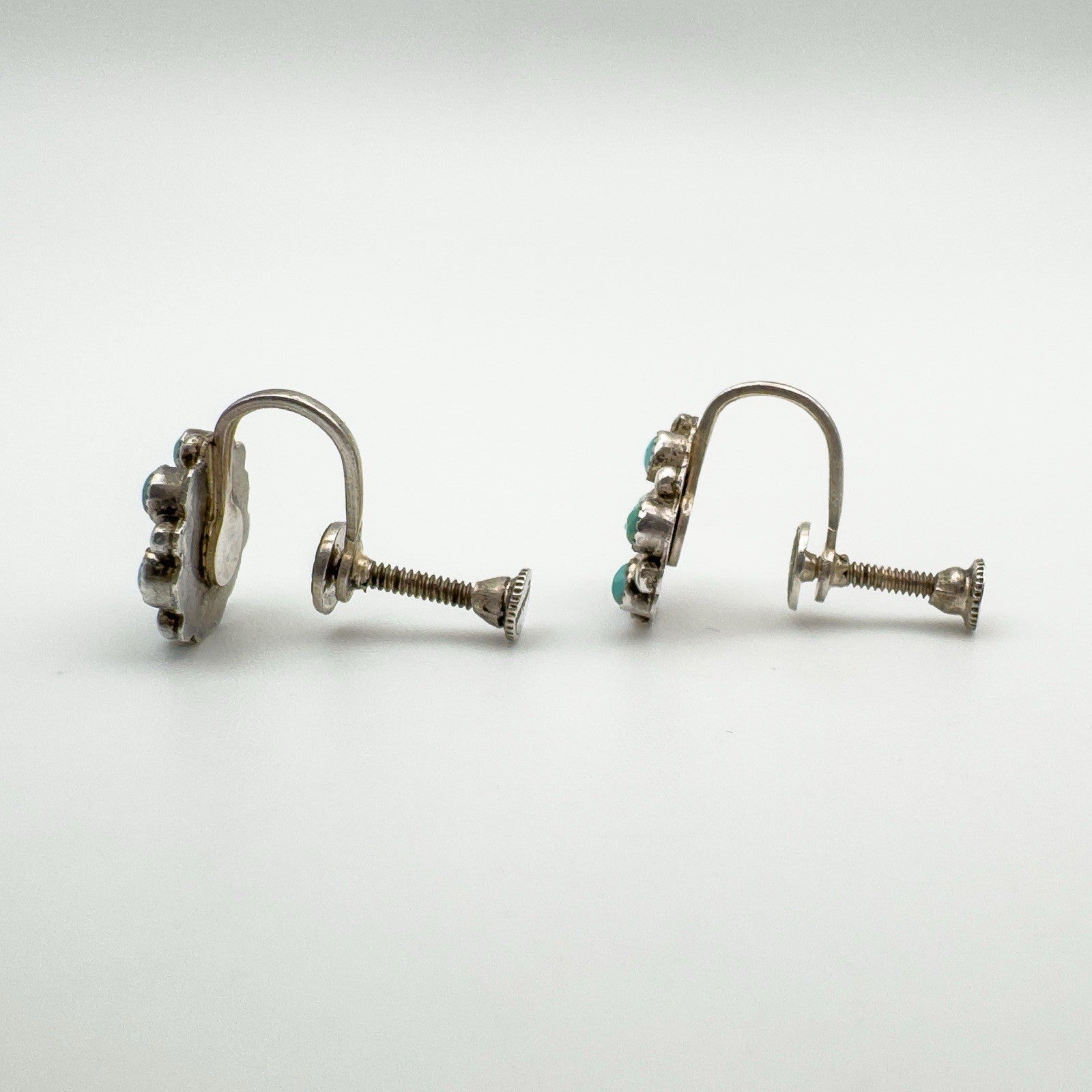 Side view highlighting screw back mechanism on vintage turquoise earrings