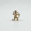 Close-up of vintage 9ct gold Sagittarius archer pendant with bow drawn